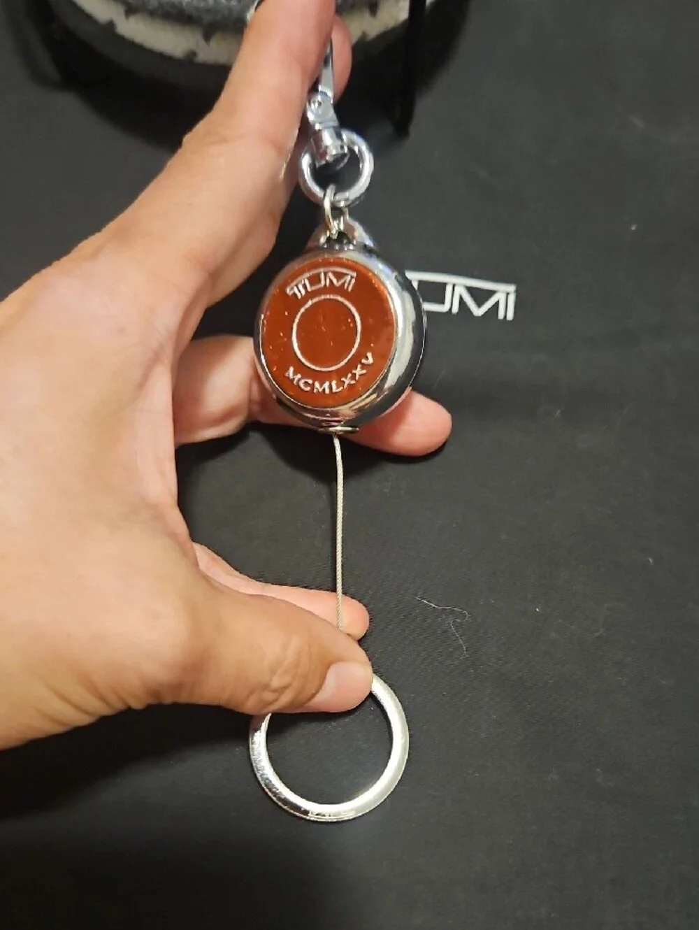 Tumi Orange Round Key Fob with Silver Hardware-retractable